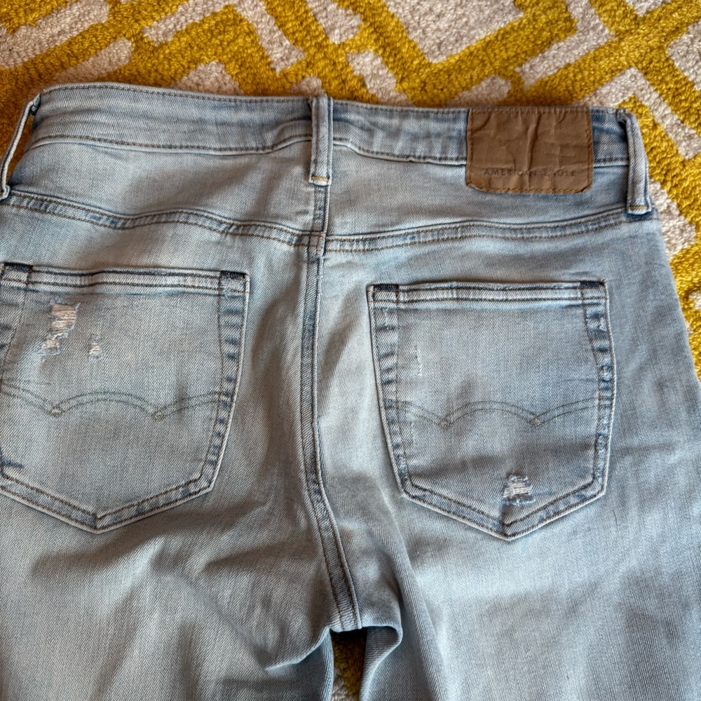 Stylish Black and Light Blue Distressed men’s Jeans - Picture 11 of 16